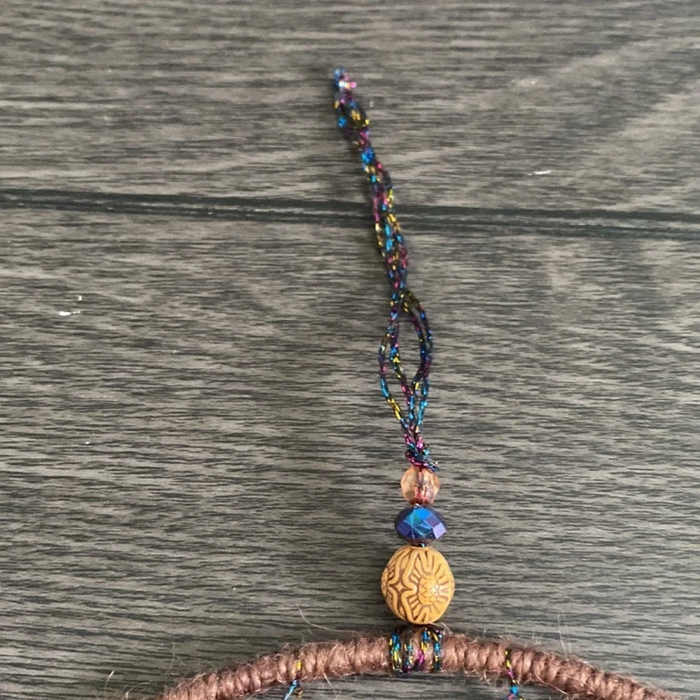 Dream catcher. Blue and tan feathers beaded. Beautiful!
